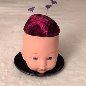 Unique Doll Head Pin Cushion with Purple Accents